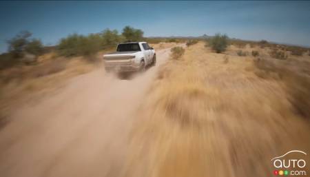 The Rivian R1T, on a dirt track during testing